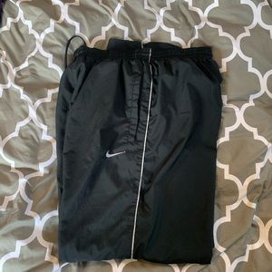 Two pair of Nike sweat pants.
